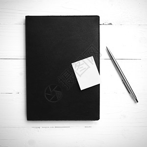 棕色笔记本和笔黑白颜色风格办公室教育木头软垫螺旋文档笔记商业白色规划师图片