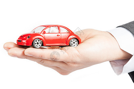 商业人对保险 购买 租赁 燃料或服务和维修费用概念的玩具汽车在商家手中图片