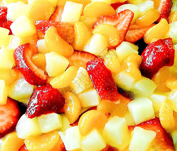 果沙拉 带草莓 橙子和桃子作为背景图片