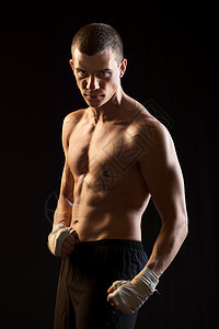 男斗士肌肉背景拳击手行动冲孔膀子男士拳头黑色跆拳道图片
