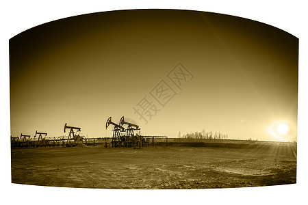 泵杰克小组太阳石油用地钻机日落勘探工业燃料井口全景图片