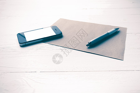 带棕色纸和笔刷样式的手机笔记商业电话文档屏幕电脑技术工作笔记本职场图片