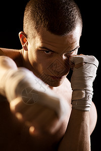 拳击韧性武术挑战男士冲孔运动手臂斗争黑色拳击手图片