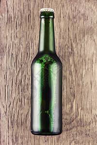 玻璃啤酒瓶瓶子绿色庆典酒精液体泡沫气泡棕色生活饮料图片