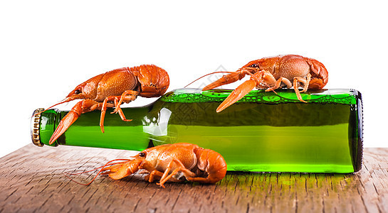 玻璃瓶啤酒和龙虾气泡液体饮料玻璃庆典酒精绿色棕色白色生活图片
