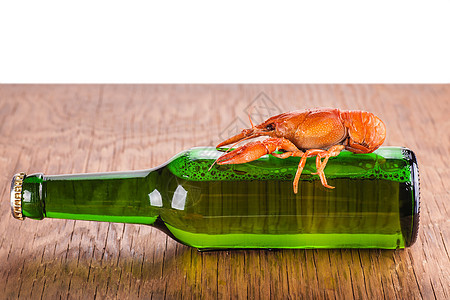 玻璃瓶啤酒和龙虾酒精庆典玻璃生活气泡饮料泡沫棕色绿色小龙虾图片