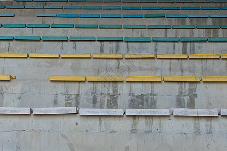 体育运动台式露天机座席白色看台体育场绿色足球运动黄色塑料椅子座位图片