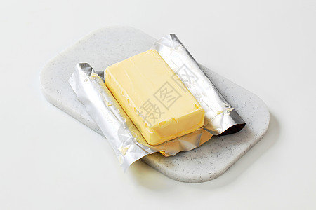 新鲜黄油块塑料黄油砧板食物锡纸奶制品图片