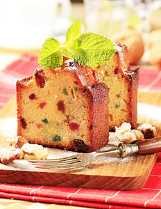 水果蛋糕切片核桃早餐蜜饯砧板小吃横截面面包葡萄干食物水果蛋糕图片