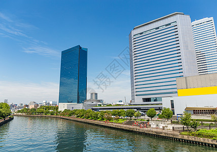 白天在大阪市经济旅行蓝色建筑学景观旅游办公室植物地标公园图片