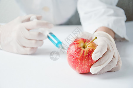 甜苹果 遗传工程生物学家食物研究员技术实验室概念生产生物注射测试图片