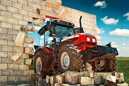 全新的拖拉机冲破墙壁场地机器栽培障碍农场驾驶农学力量技术砖块图片