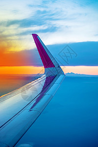 穿孔窗口见空机翼航班舷窗空气日落翅膀地平线运输阳光商业喷射图片