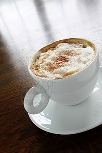 新鲜咖啡热饮白色拿铁飞碟休闲时间时光杯子图片
