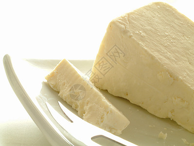 奶酪部分蓝色食物奶油状奶制品白色奶油厂背景图片