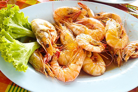 鱼炒虾蔬菜油炸搅拌海鲜餐厅红色盘子橙子贝类食物图片
