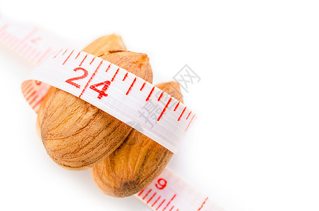杏仁坚果和测量胶带种子水果饮料重量产品健康磁带营养美食饮食图片