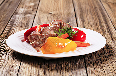 黄焖羊肉Venison 树叶和蔬菜木头美食主菜食物午餐鹿肉辣椒羊肉料理烧烤背景