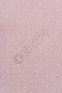 粉色和白色斑点布织物图片