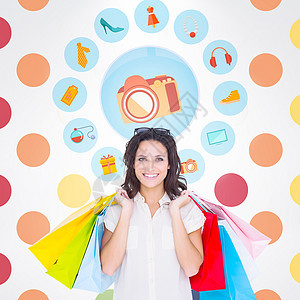 美褐色美女与购物袋的复合图像快乐购物首饰棕色微笑长发橙子蓝色零售圆点图片