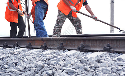 铁路堤岸 铁路和橙色背心工人修理工乌鸦奴隶铁轨平台帽子夫妻劳动机械橙子图片
