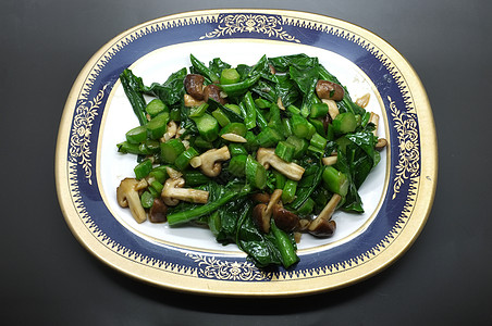 新鲜油炸绿色甘蓝和蘑菇蔬菜菠菜食物胡椒烹饪饮食美食大豆餐厅牡蛎图片