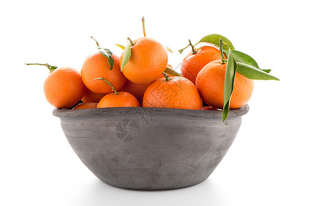 粘土碗的坦格林橙子棕色团体水果热带饮食收成柑桔店铺果汁图片