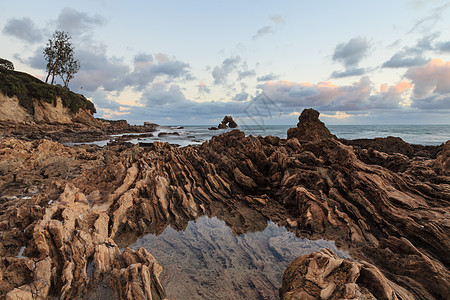 在的海滩长期接触公园日落波浪天空旅游蓝色橙子旅行支撑风景图片