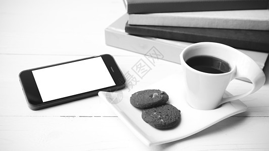 咖啡杯加饼干 手机和书卷黑白可乐细胞工作笔记本钥匙办公室电话眼镜网络咖啡桌子背景图片