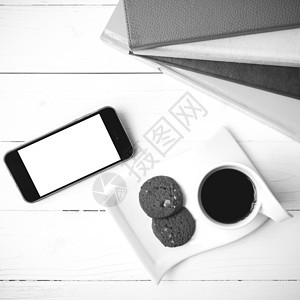 咖啡杯加饼干 手机和书卷黑白可乐眼镜细胞桌子咖啡杯子工作钥匙电话网络笔记本背景图片