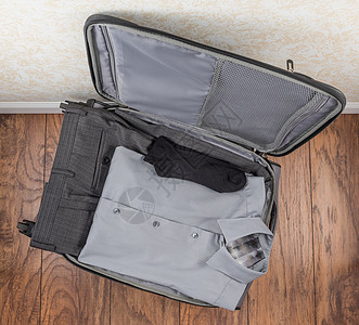 包装的男子衬衫领带旅行手提箱行李正装裤衣服男士正装袜子图片