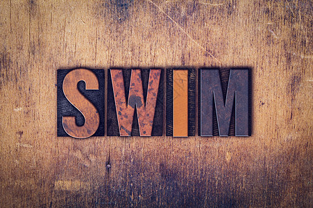 SWIM概念木制印刷品类型打印机木头游泳池中风泳装踩水蛙泳打字稿水池潜水图片