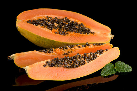 新鲜而美味的木瓜水果异国维生素裂缝饮食甜点橙子种子摸索情调图片
