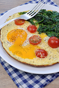 配番茄和菠菜的炒鸡蛋饮食午餐餐巾晚饭营养小菜时间蛋黄香料油炸图片