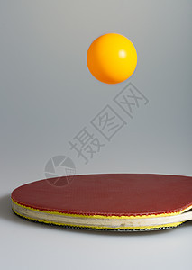 台式网球和板球橙子球拍红色灰色黑色宏观运动乒乓图片