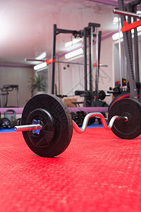 一套体育设备重量培训师辅导竞技杠铃健身房健康体育用品模拟器运动背景图片
