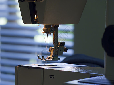 缝织机衣服女性金属纺织品工艺手工业宏观爱好修理缝纫机背景图片