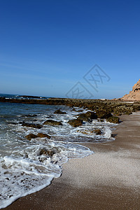 海滩海洋假期场景岩石支撑海岸海岸线蓝色旅游太阳图片