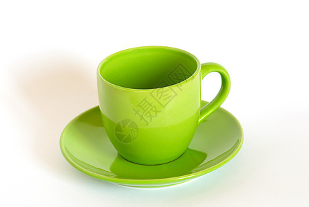 白色背景的绿茶杯和碟子图片