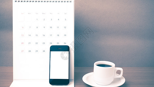 咖啡杯 电话和日历笔记本商业笔记写作铅笔白色工作职场咖啡办公室背景图片