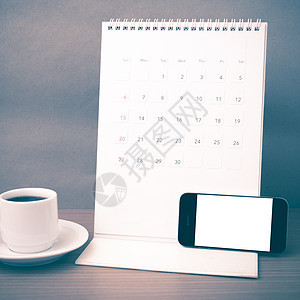 咖啡杯 电话和日历写作白色工作职场杯子桌子咖啡笔记本办公室商业背景图片