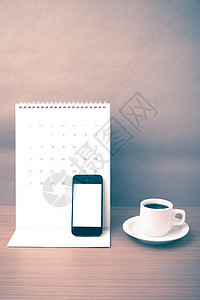 咖啡杯 电话和日历笔记本杯子铅笔咖啡工作办公室职场写作笔记桌子背景图片