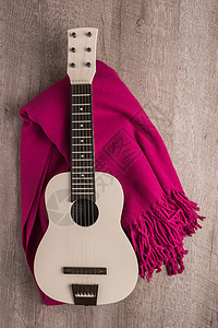 吉他和生锈木木背景质料的毯子细绳国家岩石艺术地面围巾娱乐房间音乐乐器图片