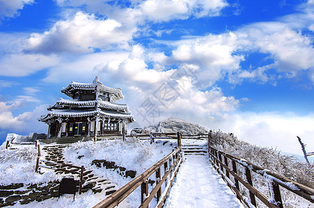 南韩冬季下雪淹没了Deogyusan山脉国家山脉晴天太阳故事旅游风景天空薄雾公园图片