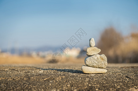 石头的冥想花园旅行生活海滩蓝色海洋岩石平衡卵石温泉图片