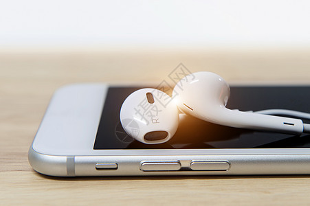 耳机和电话 轻点塑料白色歌曲电缆工具机动性电影耳塞工作室玩家图片