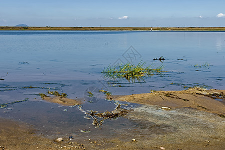 马古拉洞穴附近的拉比沙湖海岸土壤天空钓鱼衬套季节美丽洞穴绿色地面蓝色图片