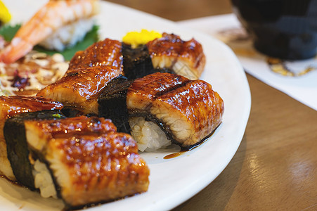 单生寿司食物盘子黑色寿司餐厅海鲜午餐美食文化奢华图片