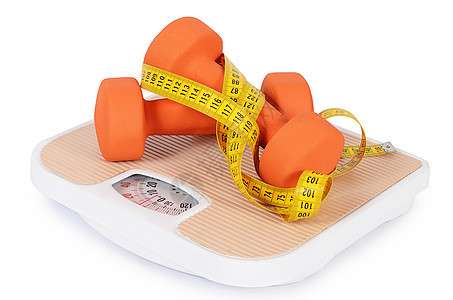 与哑铃隔离的测量磁带节食力量橙子肌肉重量药品饮食健康健身房食物图片