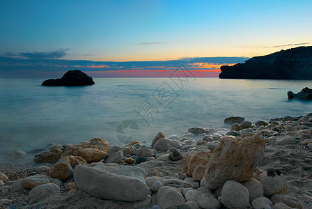 海上日落反射海滩蓝色薄雾海浪墙纸海岸太阳晴天岩石图片